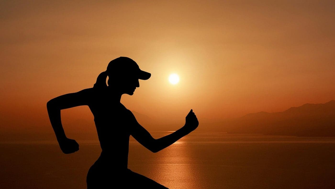 A runner in silhouette at dusk. Some days, 20 to 30 minutes after work is plenty (Photo: Mohamed_hassan / Pixabay)